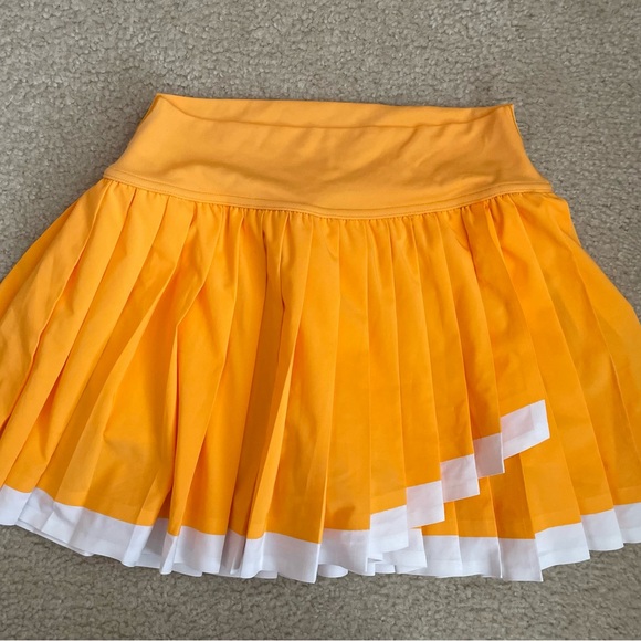 Aerie Offline Pleated Orange Skirt with White Trim and Built-in shorts - Picture 2 of 7